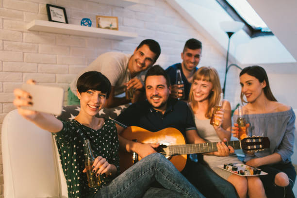 istock Young people having fun at home party. 654781782