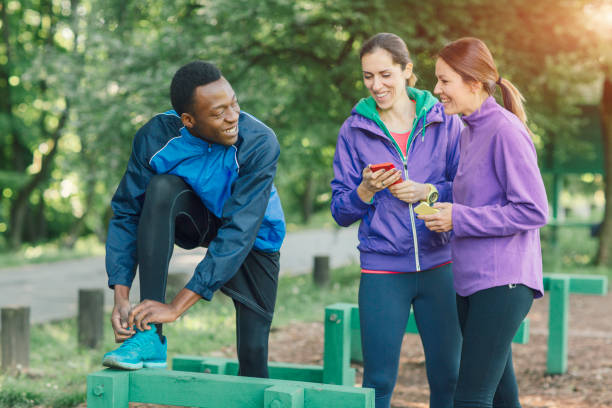 istock Friends jogging in park 654787772