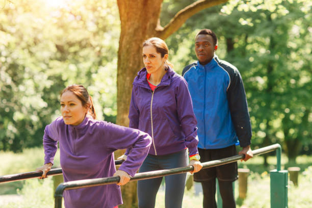 istock Friends training in park together 654788050