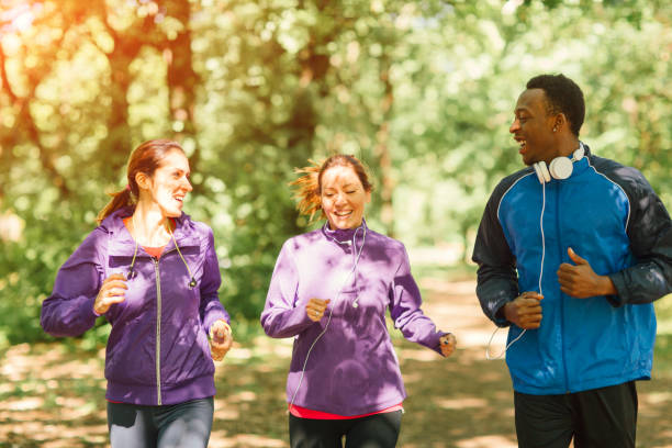 istock Friends jogging in park 654788248