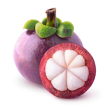 Isolated tropical fruits. One whole mangosteen and another cut in half isolated on white with clipping path