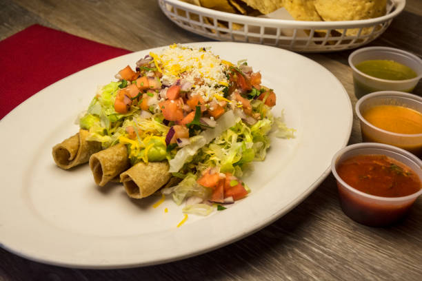 istock Rolled Mexican Taco Meal With Chips And Salsa 654791396