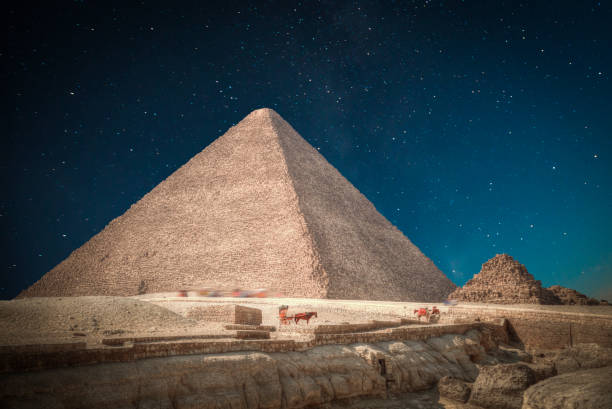 pyramids of Giza, in Egypt. Image of the great pyramids of Giza, in Egypt. At night the stars shine. great pyramid of khufu stock pictures, royalty-free photos & images