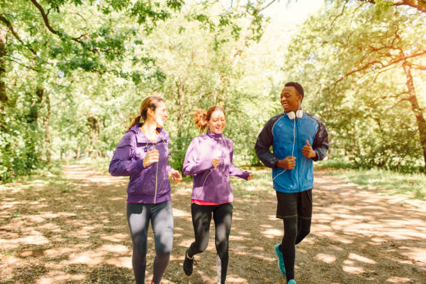 istock Friends jogging in park 654794870