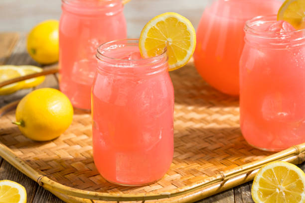 Homemade Fresh Pink Lemonade Homemade Fresh Pink Lemonade Ready to Drink lemon soda photos stock pictures, royalty-free photos & images