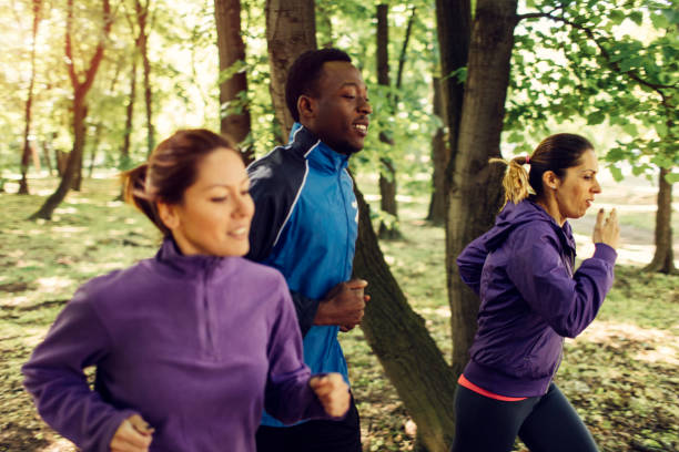 istock Friends jogging in park 654797954