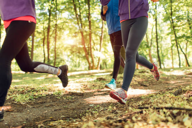 istock Friends jogging in park 654798160