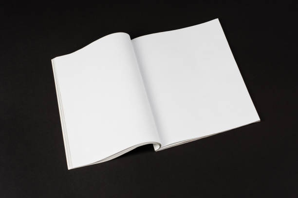 istock Mock-up magazines or catalog on natural black table background. 654798320