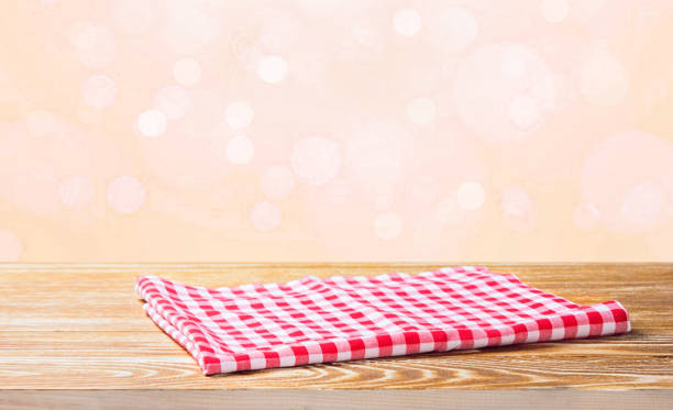 istock The checkered tablecloth on wooden table. 654811906