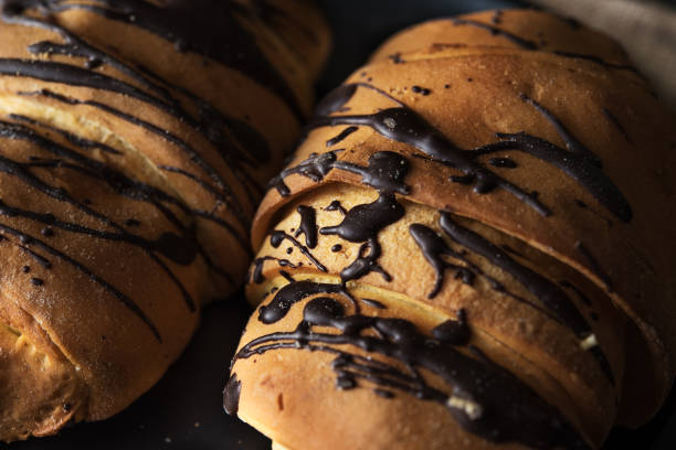istock Fresh croissant with chocolate glaze on breakfast 654815972