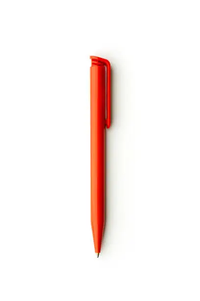 Studio shot of a new modern ballpoint pen. Material is red plastic, isolated on white background. vertical shot