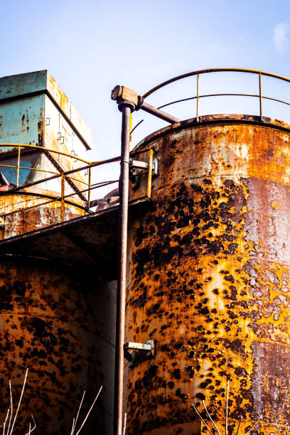 istock Rusty silos of abandoned factory 654839190