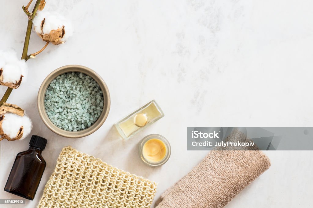 Organic spa cosmetic on marble background Spa beauty cosmetic products and tools on white marble background. Top view, copy space High Angle View Stock Photo