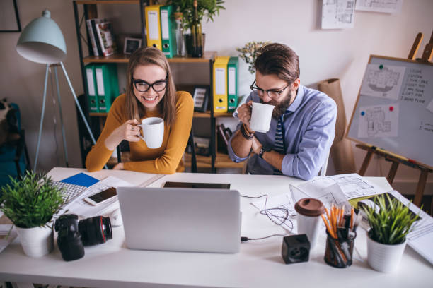 istock Couple of business people at a creative office 654845280