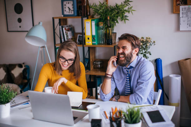 istock Young happy colleagues working together on a new plan 654847458