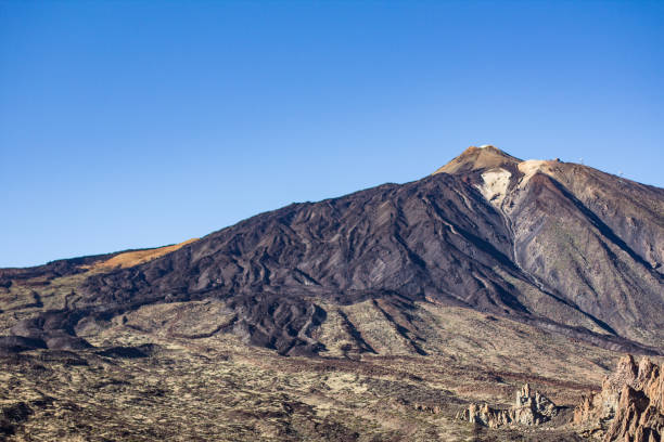 istock valley, mountain summit and clear blue sky - 654852744