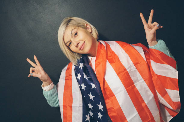 istock Blonde girl with USA flag 654862648