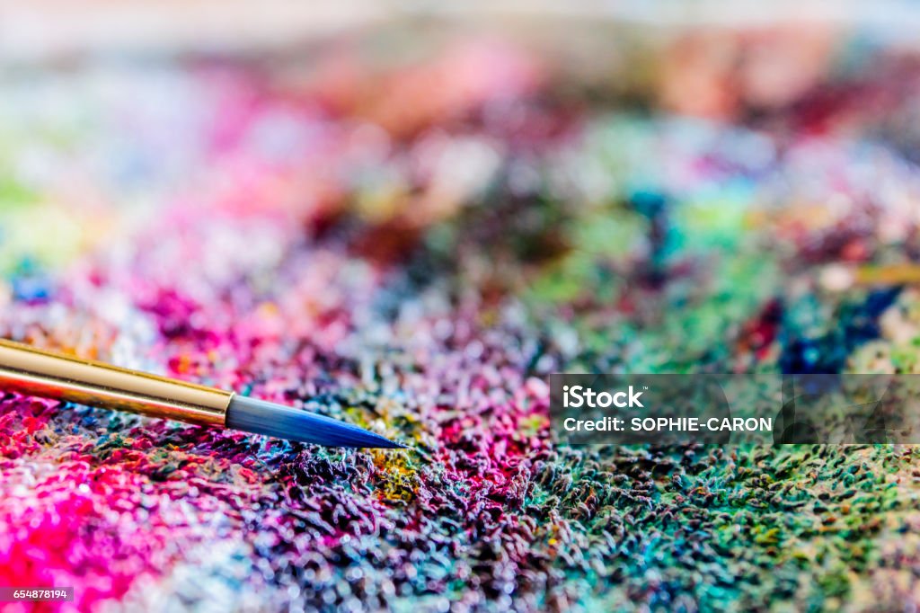 Colorful linen, watercolor A brush on a cloth stained with colored paint. Art Stock Photo