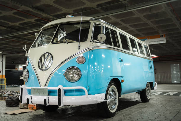 Juiz de Fora, Brazil - April 08, 2013: Vintage blue Volkswagen Kombi Transporter is seen in a parking lot in the city of Juiz de Fora, southeast of Brazil. The vehicle is produced by Volkswagen Group, a German multinational automotive manufacturing company headquartered in Wolfsburg, Lower Saxony, Germany.