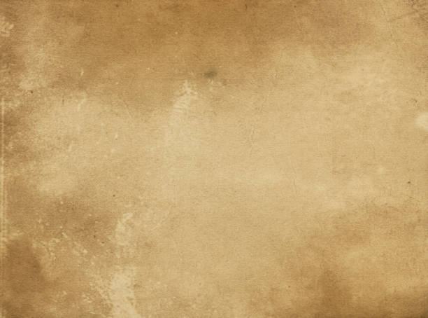 istock Old yellowed and stained paper texture. 654885948