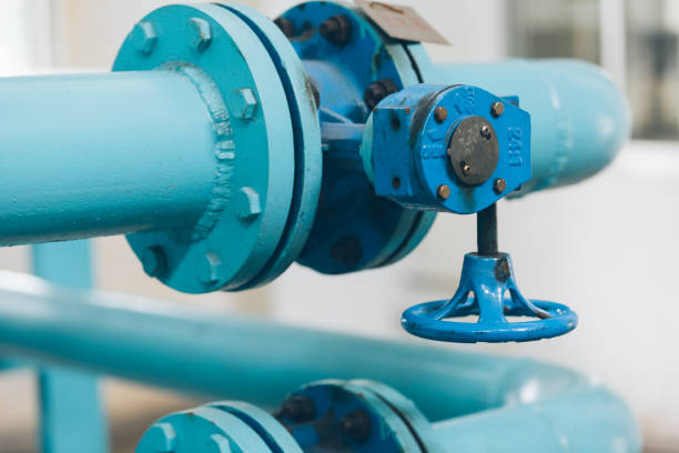 istock steel pipelines and cables in a plant 654889312