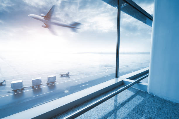 modern airport scene of passenger motion blur with window outside. stock photo