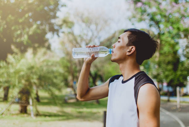 istock Sports man drinking water after exercising 654918206