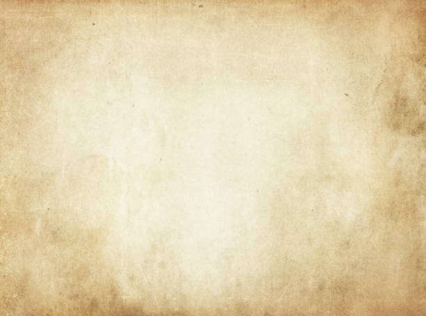 Old yellowed stained paper texture. Aged dirty and yellowed paper background for the design. Grunge paper texture. old book stock pictures, royalty-free photos & images
