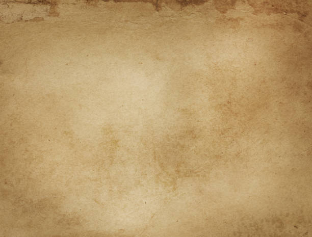 istock Old yellowed and stained paper texture. 654922970