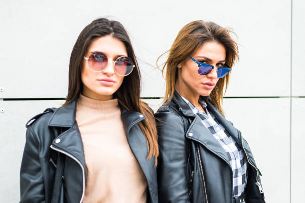 istock Two pretty young women with sunglasses 654936540