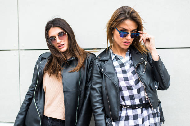 istock Two pretty young women with sunglasses 654936578