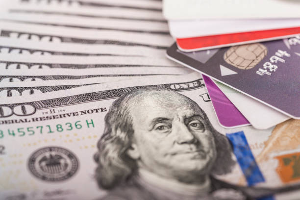 istock Credit cards on dollars 654936618