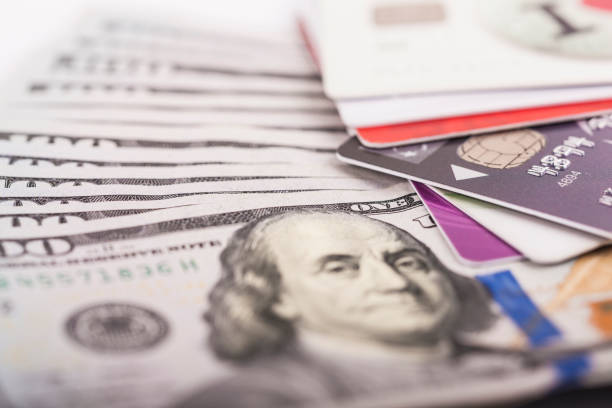 istock Credit cards on dollars 654936622