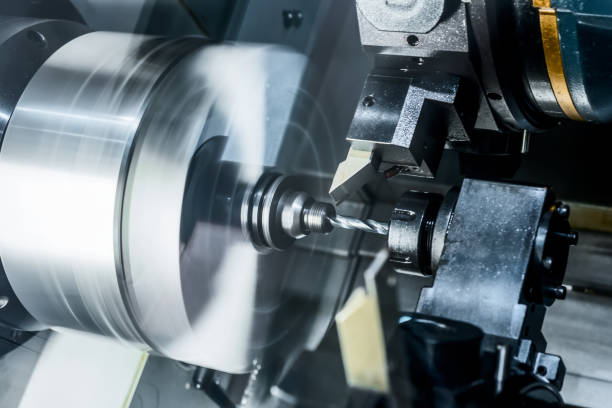 istock The CNC lathe drills a metal part 654939108