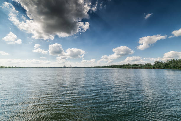 istock Clean lake and beautiful blue sky with clouds 654939540