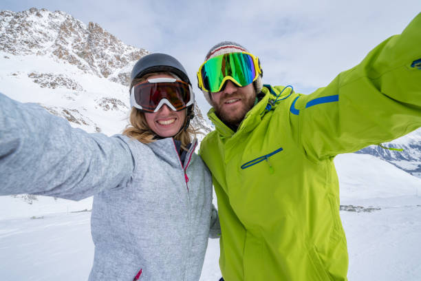 istock Young couple takin selfie on ski slope, Switzerland 654939678