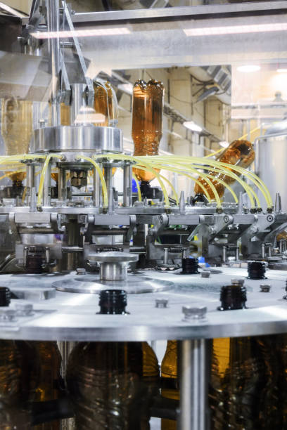 istock The filling machine pours beer into plastic PET bottles 654942704