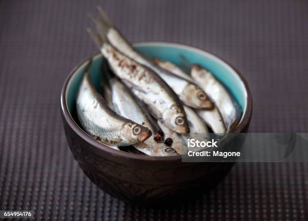 Bowl Of Salted Herring Stock Photo - Download Image Now - Anchovy, Black Color, Bowl