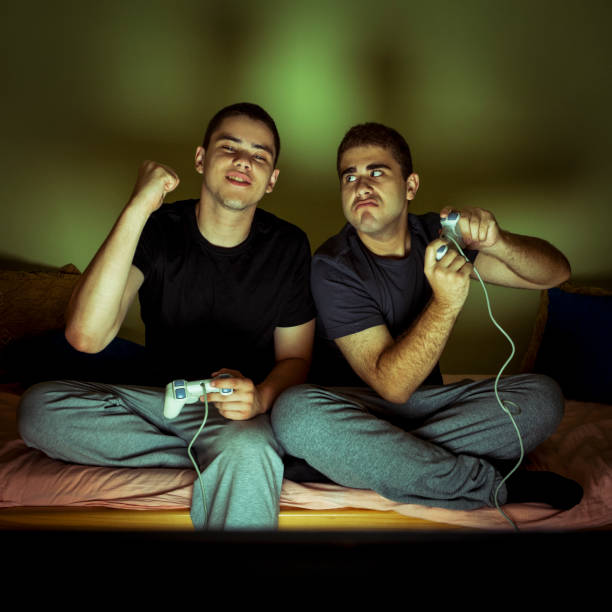 istock Friends playing video games 654954218