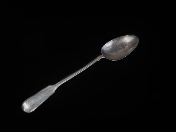 istock vintage spoon on a black background 654957042
