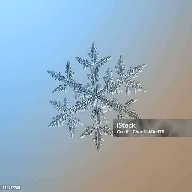 Snowflake Sparkling On Bright Gradient Background Stock Photo - Download Image Now - Abstract, Backgrounds, Blue