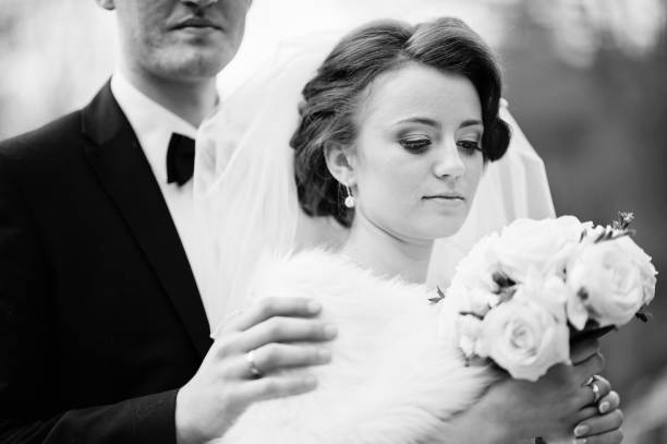 istock lovely newlyweds background waterfall at cold autumn day 654960844