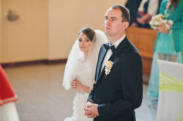 istock christian wedding couple at catholic church 654961136