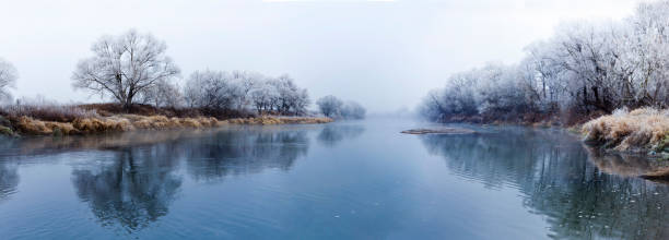 Panoranic view of river at fall misty morning stock photo