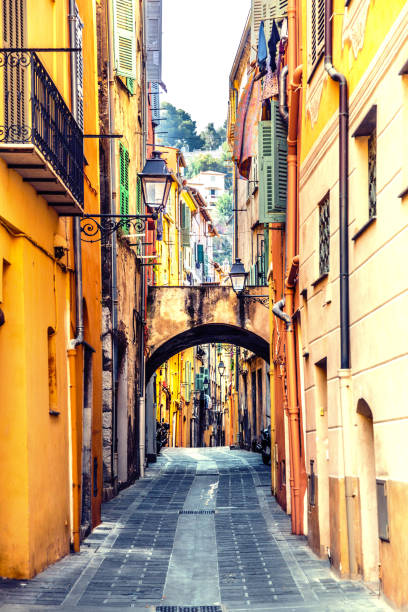 istock Narrow european lane with arch 654983850