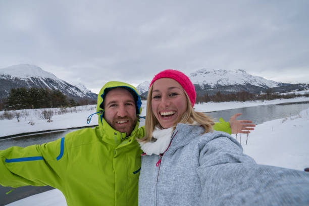 istock Young couple taking selfie in winter 654989432