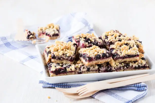 Homemade currant cornmeal crumble bars with streusel topping, healthy sweet dessert