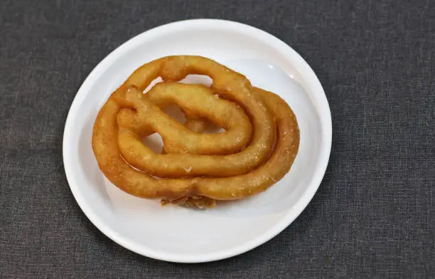 Jalebi, popular Indian sweet dessert made of deep fried dough.