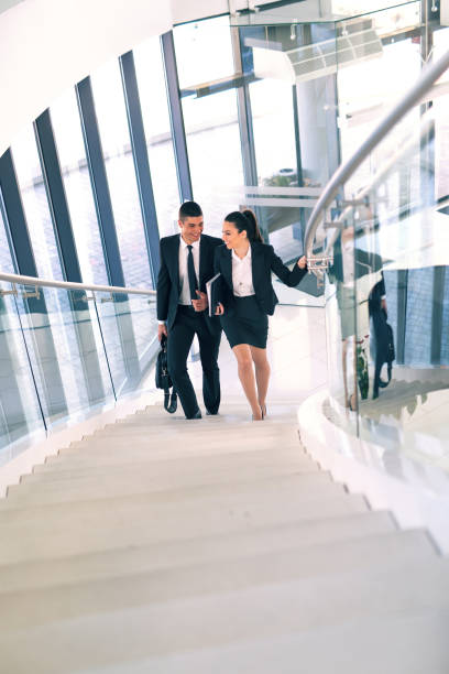 istock Business colleagues talking on stairs 654992082