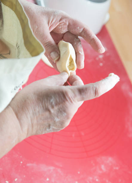 istock Cooking ruskie pierogi, dumplings 654993122